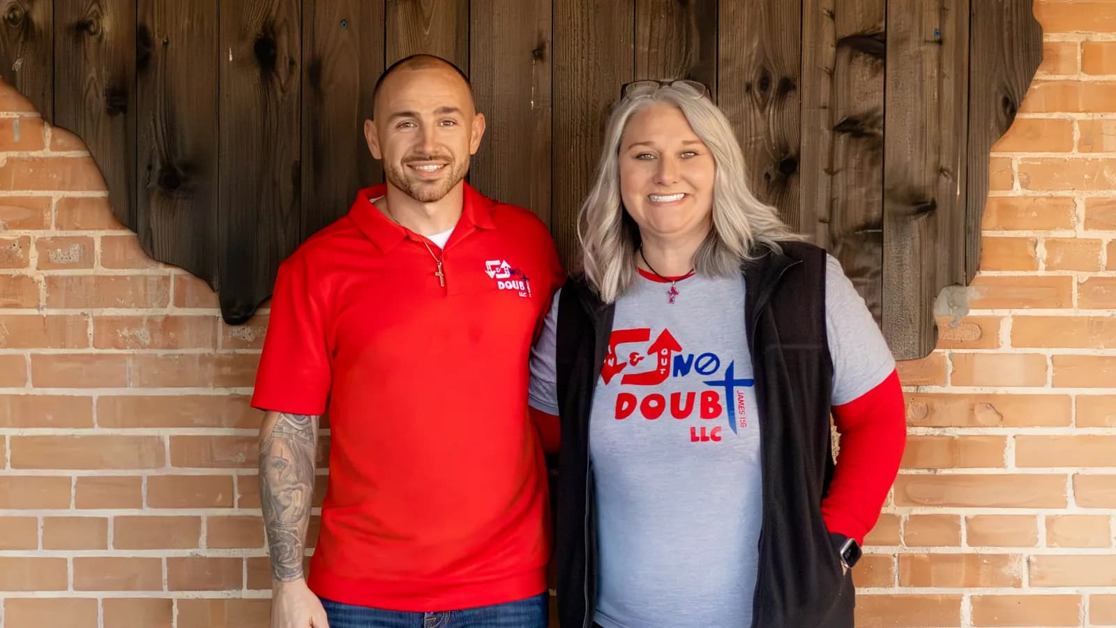 Hunter and Sheryl of In & Out No Doubt in front of a wooden Texas cutout